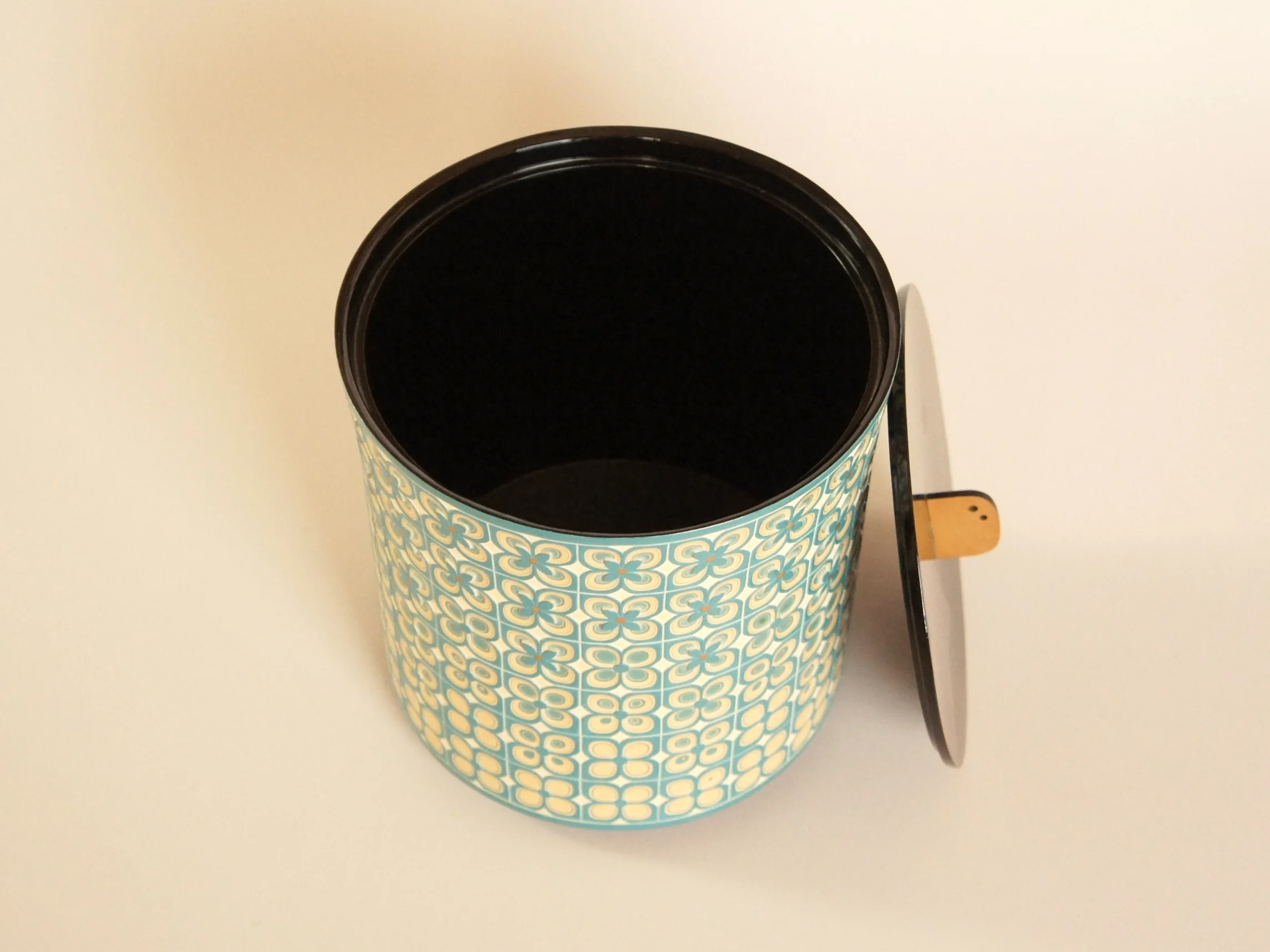 The choshitsu (carverd lacquery) Water Container titled Hydrangeas, its lid opened and viewed from above.